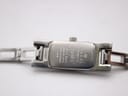 Close-up of the watch case back, showing "GUCCI", "SWISS MADE", "STAINLESS STEEL", "WATER RESISTANT 3 ATM", and "3900L".