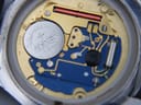 Macro shot of the Tissot quartz movement, showing the Renata 371 battery and calibre 955.112.