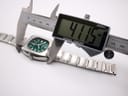 Digital caliper measuring the lug-to-lug length of the Seiko 7006-5070 case, showing a reading of 41.15 mm.