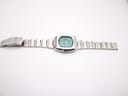 Full length view of the Seiko 7006-5070 watch and its integrated stainless steel bracelet, laid flat.