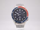 Front view of the Seiko 7546-6040 quartz diver watch, dark blue dial with Pepsi bezel on a stainless steel bracelet.