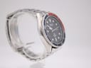 Left profile view of the Seiko diver watch on a clear display stand, showcasing the case shape and bracelet links.