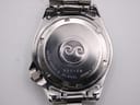 Close-up of the stainless steel case back, engraved with serial number 923128, model 7546-6040, and water resist marking.