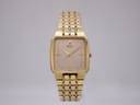 Front view of gold tone Seiko 6531-5170 square quartz watch with a minimalist dial and integrated bracelet.