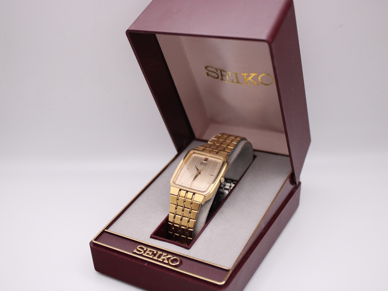 Gold tone Seiko 6531-5170 watch nestled in its original burgundy Seiko presentation box.