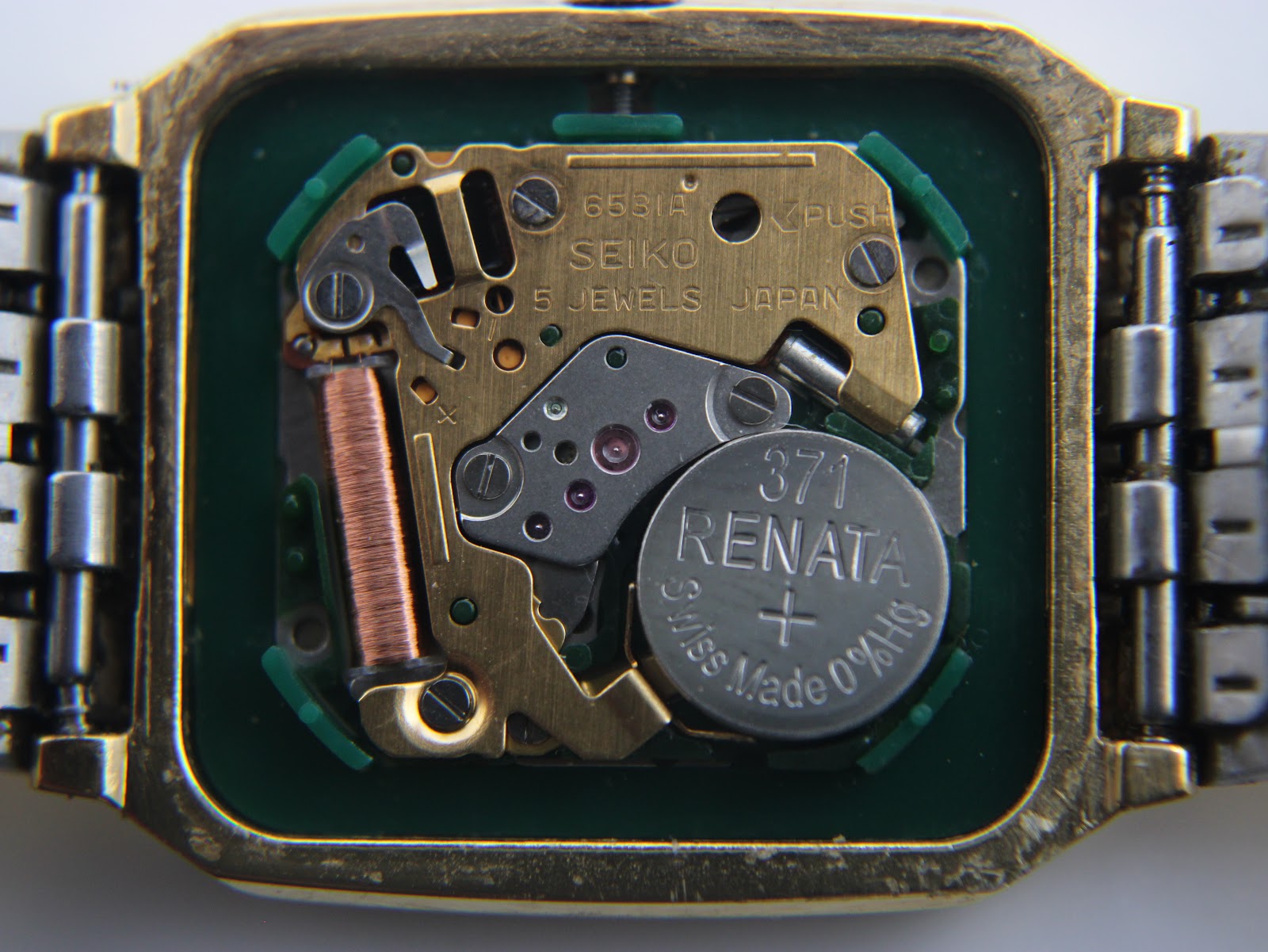 Open case back revealing the Seiko 6531A quartz movement with 5 jewels and a Renata 371 battery.