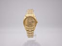 Front view of gold tone Seiko 4206-0331 automatic watch with day-date on a clear stand.