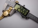 Digital caliper measuring the case diameter of the Seiko watch at 24.59mm.