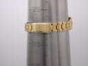 Gold tone Seiko bracelet clasp being measured on a wrist sizing cone, showing a size of 15.5cm.