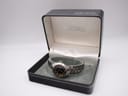 Seiko 5 watch with two-tone bracelet displayed in its original black and silver Seiko presentation box.