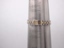 Seiko two-tone bracelet on a wrist sizing gauge, showing a measurement of approximately 155mm / 15.5cm.