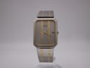 Frontal angled view of a vintage Seiko 2A32-5060 two-tone quartz dress watch resting in its open original navy presentation box.