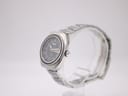 Close-up of Seiko signed folding clasp on stainless steel bracelet showing brushed finish and stamped Seiko logo
