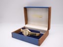 Front view of vintage Seiko 2205-0250 automatic watch with champagne sunburst dial, gold baton indices, and date at 3 o'clock.