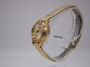 Side profile of the gold-plated vintage Seiko Hi-Beat watch showing the domed acrylic crystal and expanding bracelet.