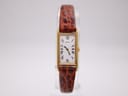 Front view of Seiko 2E20-6120 rectangular gold-plated ladies dress watch, showing white dial with black Roman numerals and slim baton hands.