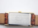 Close-up of the brushed stainless steel case back of the Seiko 2E20-6120, showing model number and serial 070388.