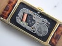 Macro shot of the Seiko 2E20B quartz movement inside the case, showing the fitted Renata 317 battery and 'ONE JEWEL' text.