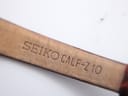 Close-up of the underside of the brown calf leather strap, clearly showing the 'SEIKO CALF-Z10' stamp.