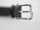 Close-up of the polished silver-tone pin buckle, engraved with "SEIKO".