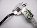 Digital caliper measuring the case diameter of the Seiko Spirit watch, displaying 23.12 mm.