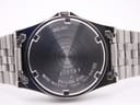 Detail of Seiko five-link stainless steel bracelet showing brushed outer links and polished inner link edges