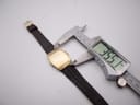Digital caliper measuring the length of the Seiko watch case, showing 35.51mm.