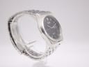 Another angled side view of the Seiko watch, highlighting the integrated bracelet.