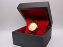 Seiko gold-tone watch presented in a black and red display box.