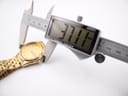 Digital caliper measuring the case diameter of the Seiko watch, displaying 37.1 mm.