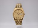 Front view of the gold-tone Seiko 7N43-8111 watch with a champagne gold dial, fluted bezel, and jubilee bracelet.