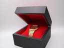 Seiko 8123-5110 gold tone watch displayed in an open black box with red lining.