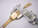 Digital caliper measuring the case diameter of the Seiko watch, displaying a precise measurement of 33.36mm.