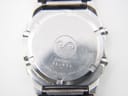 Close-up of the stainless steel case back of the Seiko A229-5060, revealing the serial number 982034 and "WATER RESISTANT" engraving.