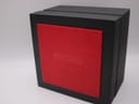 Exterior view of the black Seiko presentation box with a red textile panel embossed with the Seiko logo.