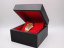 Seiko watch displayed open in a black and red generic presentation box.