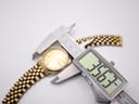 Digital caliper measuring the case diameter of the Seiko watch, showing 35.67 mm.