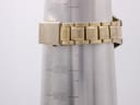 Close-up of the gold tone bracelet's signed Seiko clasp on a wrist sizing gauge showing a 172mm measurement.