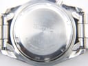 Close-up of the watch's stainless steel case back, displaying "SEIKO", serial number 770322, model 5M63-0B90, and water resistance details.