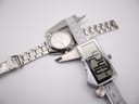 Overhead view of the Seiko Kinetic watch being measured by a digital caliper, displaying a case diameter of 42.40 mm.