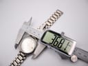 Digital caliper measuring the case diameter of the Seiko watch, showing 36.81mm.