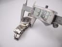 Digital caliper measuring the case diameter of the watch, displaying a measurement of 37.83mm.