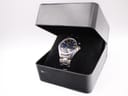 The Seiko watch nestled in a black presentation box.