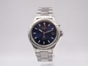 Front view of Seiko Kinetic SQ 50 watch with navy dial and stainless steel bracelet.