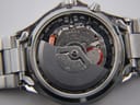 Close-up of Seiko 5M42A Kinetic movement inside the watch case.