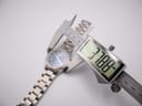 Digital caliper measuring the watch case diameter at 37.88mm.
