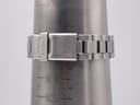 Wrist sizing gauge showing the stainless steel bracelet and signed Seiko deployant clasp, measuring approx 19.3cm.