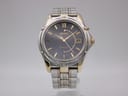 Front view of the Seiko Kinetic 5M62-0C70 watch with a navy dial, gold indices, and a two-tone silver and gold stainless steel case and bracelet.