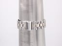 Close-up of the two-tone stainless steel bracelet wrapped around a wrist sizing gauge, showing a measurement of 188mm.