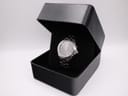 The Seiko Kinetic watch nestled within a black presentation box with a velvet interior.